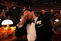 A reaction image of Bad Bunny crying. It is a meme from the Grammys 2026.