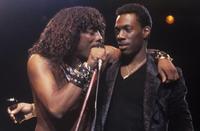 Rick James and Eddie Murphy performing on stage during the mid 1980s