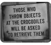 THOSE WHO THROW OBJECTS AT THE CROCODILES WILL BE ASKED TO RETRIEVE THEM