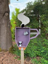 I’ve seen neighborhood Little Book Libraries but never a coffee cup library before