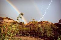 A rainbow and lightning