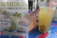 THE GREENLIGH OUR SUMMER REFRESHER CALORIE 50 ONLY 50 CALORIES LIGHTLY CAFFEINATED NO ADDED SUGARS NO GMOS NO ARTIFICIAL SWEETENERS NO ARTIFICIAL COLORS NO ARTIFICIAL FLAVORS NO PRESERVATIVES