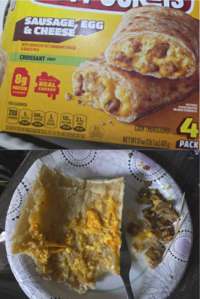 SAUSAGE EGG & CHEESE WITH REDUCED FAT CHEDDAR CHEESE & SAUCE IN A CROISSANT CRUST 8g PROTEIN per sandwich MADE WITH REAL CHEESE PER1SANDWICH 280 5 500 3 120mg 2.1mg CALORIES SAT FAT SODIUM TOTAL CALCIUM IRON SUGARS 25% DV 22% DV 10% DV 10% DV SEE NUTRITION INFORMATION FOR TOTAL FAT, SAT FAT AND SODIUM CONTENT U.S. INSPECTED AND PASSED BY DEPARTMENT OF AGRICULTURE COOK THOROUGHLY KEEP FROZEN SERVING SUGGESTION ENLARGED TO SHOW DETAIL 4 NET WT 17 oz (1 lb 1 oz) 481g PACK