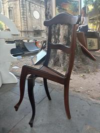 This chair has front legs carved to look like they are crossed