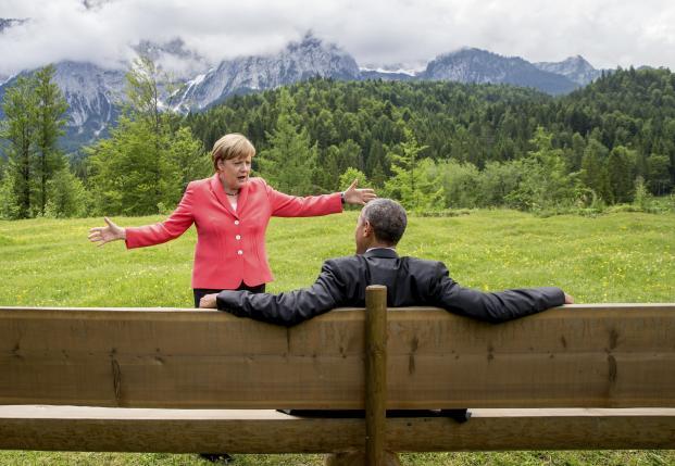 German Chancellor Angela Merkel speaks with U.S. President Barack Obama outside the Elmau castle in Kruen near Garmisch-Partenkirchen, Germany, June 8, 2015.
