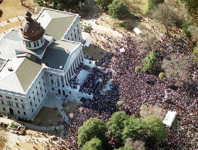 "The State":http://www.thestate.com/news/local/article25302169.html - An estimated 46,000 people marched in downtown Columbia, SC Monday (1/17/2000) protesting the flying of the Confederate flag atop the State House dome. The march and rally, commemorating the life and work of the late Rev. Martin Luther King Jr. , was without any major incidents. The flag has been flying since 1962 when the S.C Legislature raised the flag to celebrate the Civil War centennial. This march is also apparently the one of the largest in South Carolina history.

Photo Credit: ERIK CAMPOS