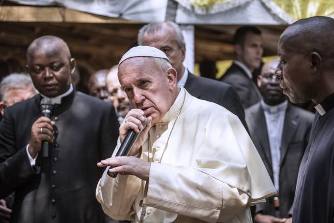 picture of Pope Francis holding a wireless mic like a rapper and looking like he's about to drop a bar