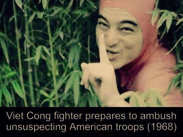 Viet Cong fighter prepares to ambush unsuspecting American troops (1968)