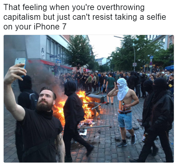 That feeling when you're overthrowing capitalism but just can't resist taking a selfie on your iPhone 7