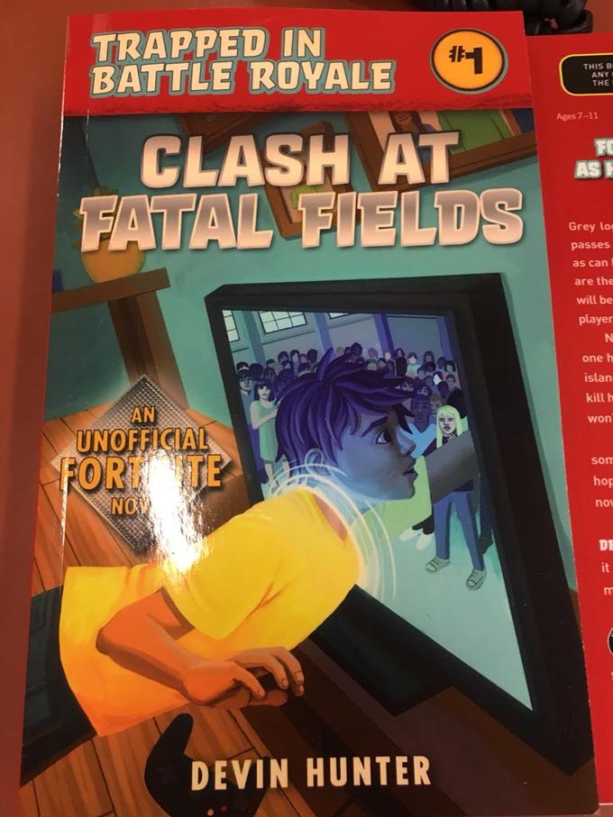 TRAPPED IN BATTLE ROVALE 非 THIS B ANY THE Ages 7-11 CLASH AT FATAL FIELDS FO AS Grey los passes as can are the will be player one h islan kill h won AN UNOFFICIAL FORT TE som hop nov OV DE it DEVIN HUNTER