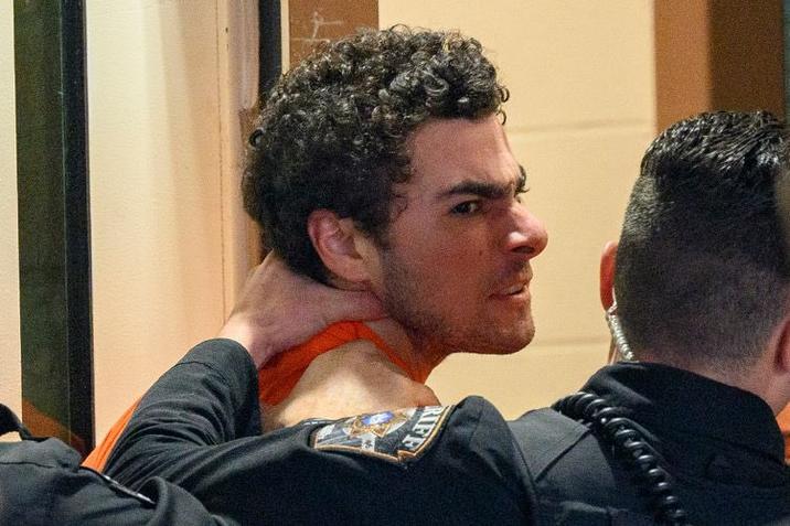 A photo of Luigi Mangione being manhandled by PA police.