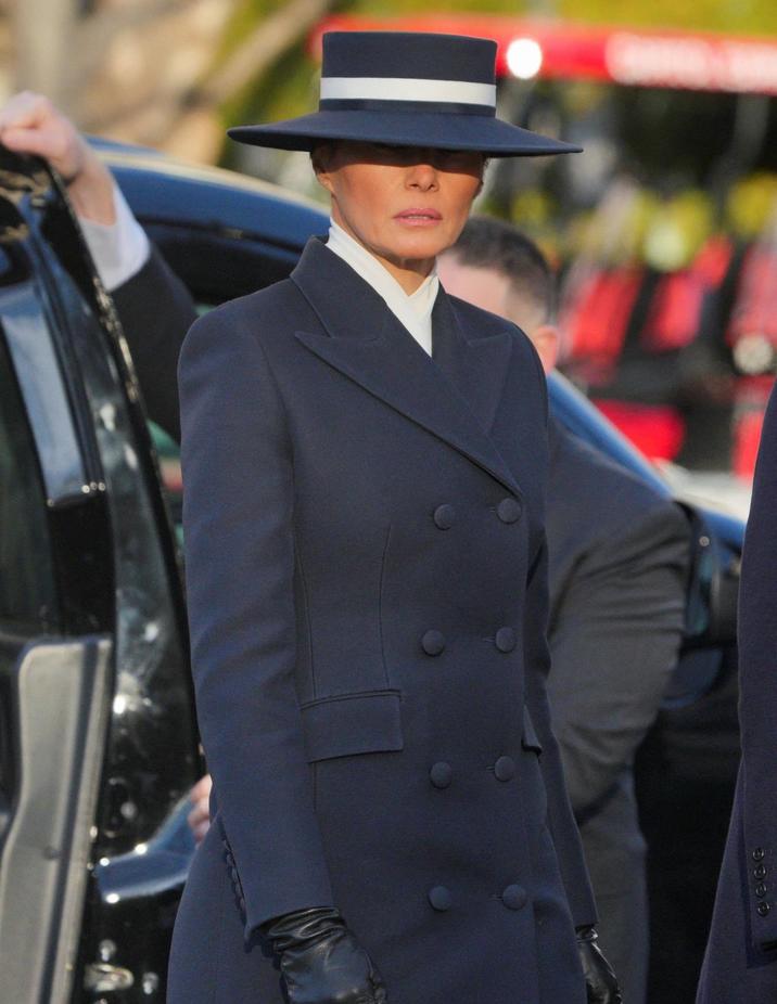 A photograph of FLoTUS Melania Trump wearing a brimmed hat at Donald Trump's second inauguration