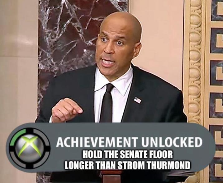 A "meme":https://knowyourmeme.com/memes/memes using the "Fake Xbox 360 Achievements":https://knowyourmeme.com/memes/fake-xbox-360-achievements format about "Cory Booker":https://knowyourmeme.com/memes/people/cory-booker defeating the previous Senate speech record.