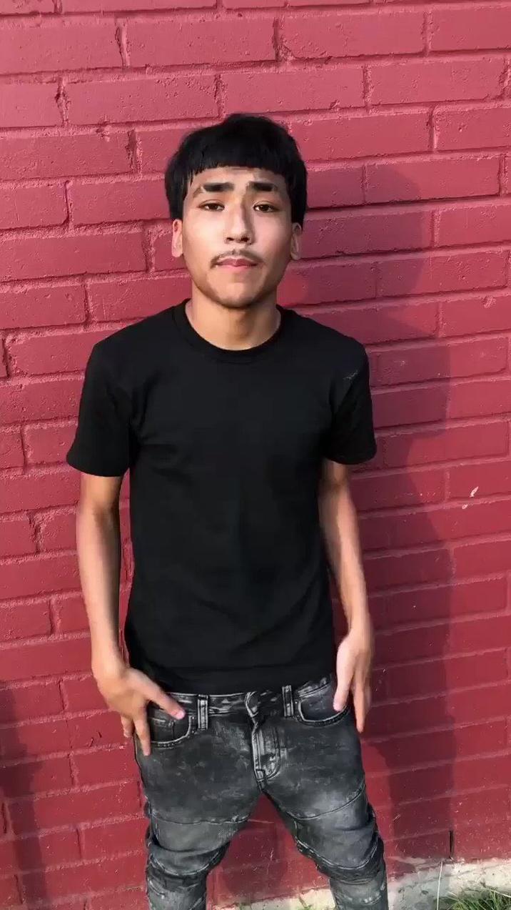 The photo of Latino "Edgar":https://knowyourmeme.com/memes/edgar-edgar-haircut "influencer":https://knowyourmeme.com/memes/social-media-influencer and "TikToker":https://knowyourmeme.com/memes/sites/tiktok Lil G standing in front of a red brick wall, which became a meme on "Twitter / X":https://knowyourmeme.com/memes/sites/twitter-x and "Instagram":https://knowyourmeme.com/memes/sites/instagram in 2025.