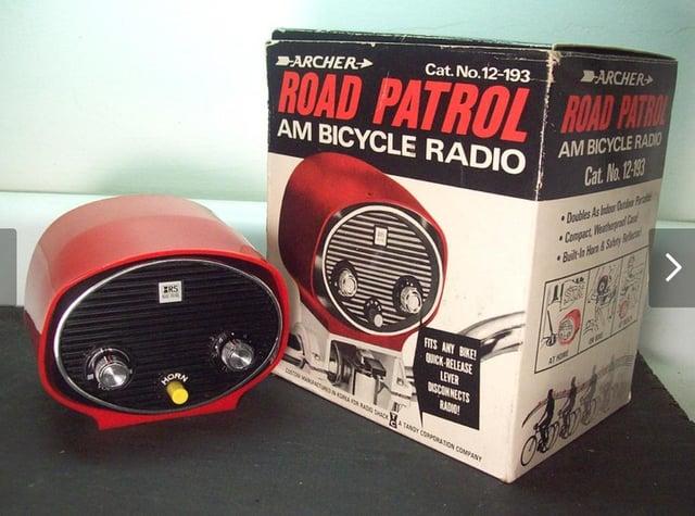 IRS HORA ARCHER Cat. No.12-193 ARCHER ROAD PATROL ROAD PATROL AM BICYCLE RADIO AM BICYCLE RADIO Cat. No. 12-193 Doubles As Intur er Prat Compact Weather Ca Built-In Hare & Subery Red FITS ANY BIKE! QUICK RELEASE LEVER 唱 DISCONNECTS CCTV ADACTANDY CORPORATION COMPANY ATHOR