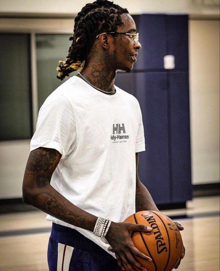Young Thug Holding a Basketball Photo A photo of "rapper":https://knowyourmeme.com/memes/cultures/rap-hip-hop "Young Thug":https://knowyourmeme.com/memes/people/young-thug holding a "basketball":https://knowyourmeme.com/memes/cultures/basketball, often used in the He Don't Got Internet "meme":https://knowyourmeme.com/memes/memes.