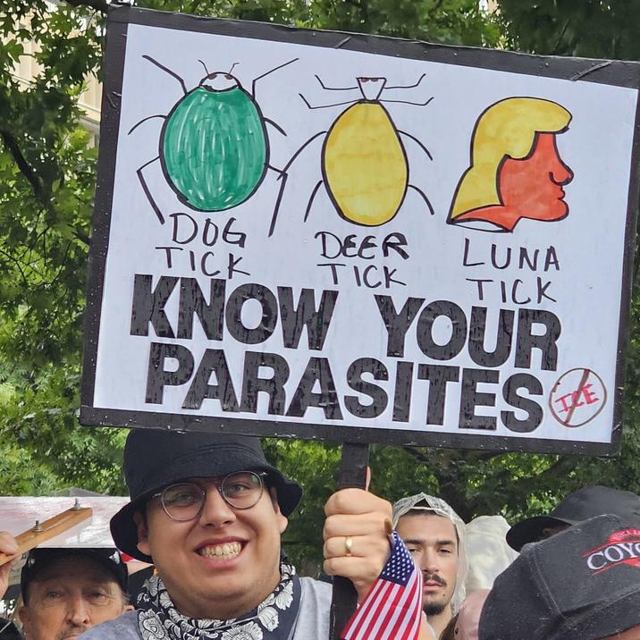 A sign from an Oklahoma City protest, showing "Donald Trump":https://knowyourmeme.com/memes/people/donald-trump as a "Luna Tick."