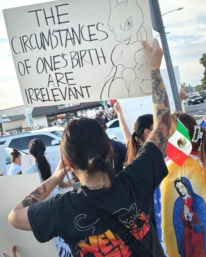 A sign at a No Kings protest showing "Mewtwo":https://knowyourmeme.com/memes/mewtwo the "Pokémon":https://knowyourmeme.com/memes/subcultures/pokemon and text reading, "The circumstances of one's birth are irrelevant."