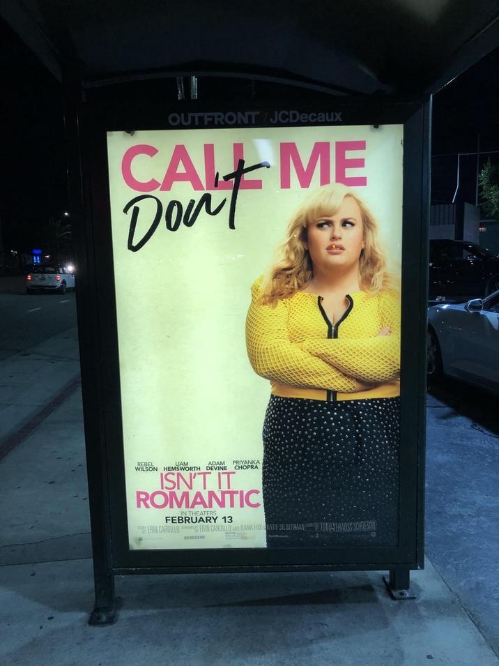 OUTFRONT/JCDecaux CALL ME Don't X REBEL LIAM ADAM PRIYANKA WILSON HEMSWORTH DEVINE CHOPRA ISN'T IT ROMANTIC IN THEATERS FEBRUARY 13 STY ERIN CARDILLO SCREENPLAY ERIN CARDILLO AND DANA FOX KATIE SILBERMAN FODD-STRAUSS-SCHULSON BROM