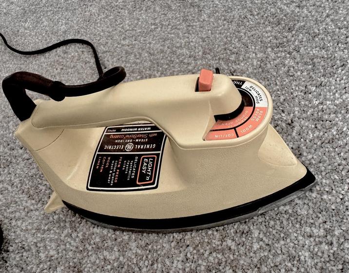 RM RESS DELICATES low..... WOOL COT/LIN steam in orange FILL LIGHT'n EASY CATES synthet rayons GENERAL wash & wear ELECTRIC STEAM DRY IRON with SilverStone coating WATER WINDOW REFILL
