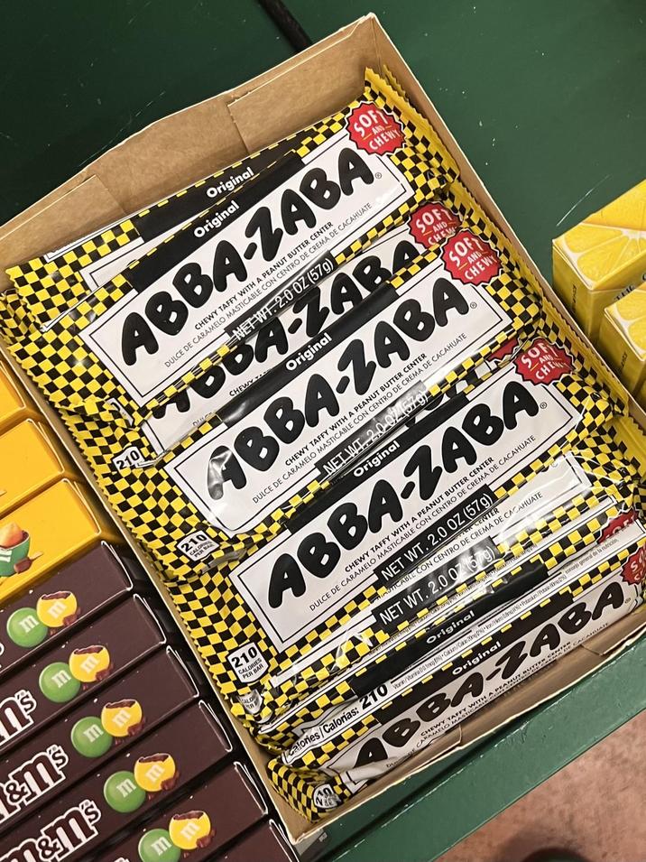 m m m &M³ M's m n&m³ m 210 CALORIES PER BAR 210 Original Original CHEWY TAFFY WITH A PEANUT BUTTER CENTER ABBA-ZABA DULCE DE CARAMELO MASTICABLE CON CENTRO DE CREMA DE CACAHUATE NET WT. 2.0 OZ (57g) TODA-ZABA DIS CHEWY - Original CHEWY TAFFY WITH A PEANUT BUTTER CENTER ABBA-ZABA DULCE DE CARAMELO MASTICABLE CON CENTRO DE CREMA DE CACAHUATE NETW 2.0.07 (57) Original CHEWY TAFFY WITH A PEANUT BUTTER CENTER ABBA-ZABA DULCE DE CARAMELO MASTICABLE CON CENTRO DE CREMA DE CACAHUATE calories/Calorías: 210 g) be NET WT. 2.0 OZ (57g) PER CENTER ASTICABLE CON CENTRO DE CREMA DE CACAHUATE ET WT. 2.0 071579) ▼———¯¯¯ Original Original Vitamin/Vitamina D 0.1mcg (9) Cakim/Cako 20mg 0%)• kon/Hermo 0.8mg (45) Polarsum/Putacio mo Original consejo p o general de la nutrición ABBA-ZABA DU CARA W NUT BU TER CHEWY TAFFY WITH A MADE CACAHUATE ARAMELO MAS CATH SOFT CHEWY SOF AND- CHEW SOFT AND CHEWY SOF CHE AN