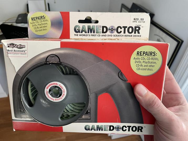 PlayStation "Best Accessory" 1999 Editors' Award REPAIRS: Audio CDs, CD-ROMS, DVDs, PlayStation, CD-Rs and other CD-sized discs. $29.99 GAME DOCTOR 1746569 GAMED CTOR THE WORLD'S FIRST CD AND DVD SCRATCH REPAIR DEVICE TM WARNING! Keep REPAIRS: Audio CDs, CD-ROMs, DVDs, PlayStation, CD-Rs and other CD-sized discs. GAMED CTOR TM