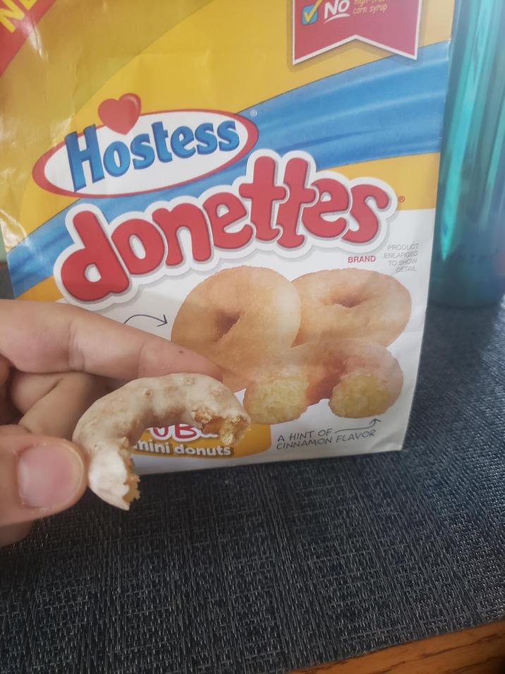 NO corn syrup Hostess @ donettes BRAND PRODUCT ENLARGED TO SHOW DETAIL UB mini donuts A HINT OF CINNAMON FLAVOR
