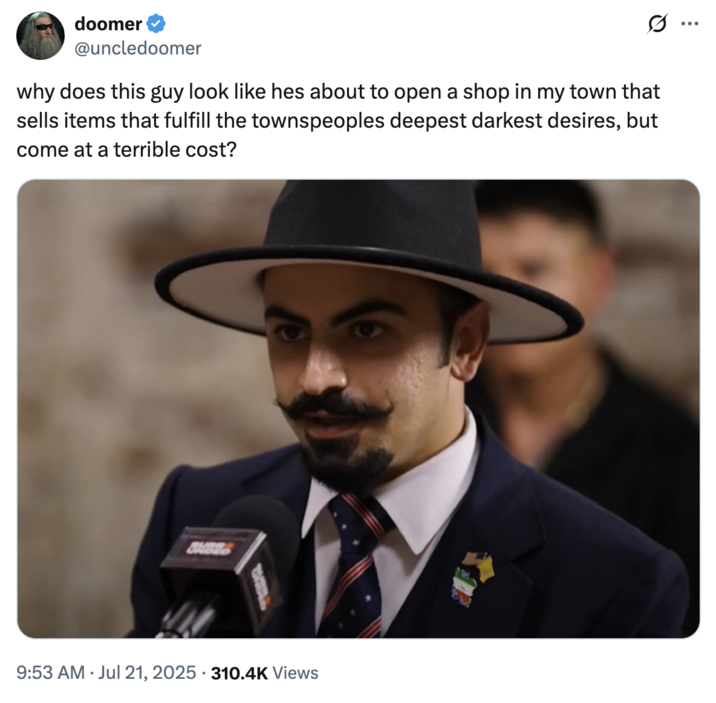 July 21st, 2025 tweet by @uncledoomer X user @uncledoomer tweeted an image of Matin Samimiat from the Jubilee video featuring Mehdi Hasan, writing, "why does this guy look like hes about to open a shop in my town that sells items that fulfill the townspeoples deepest darkest desires, but come at a terrible cost?"