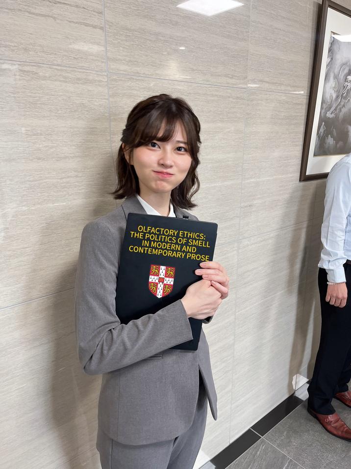 July 26th, 2025 tweet by @Andr3jH X user @Andr3jH posted an image of Saori Araki dressed as a Japanese salarywoman to show her holding "Dr. Ally Louks' "Olfactory Ethics: The Politics of Smell in Modern and Contemporary Prose" PhD Study":https://knowyourmeme.com/memes/dr-ally-louks-olfactory-ethics-the-politics-of-smell-in-modern-and-contemporary-prose-phd-study
