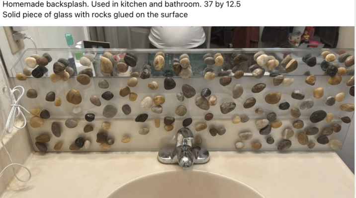 Homemade backsplash. Used in kitchen and bathroom. 37 by 12.5 Solid piece of glass with rocks glued on the surface