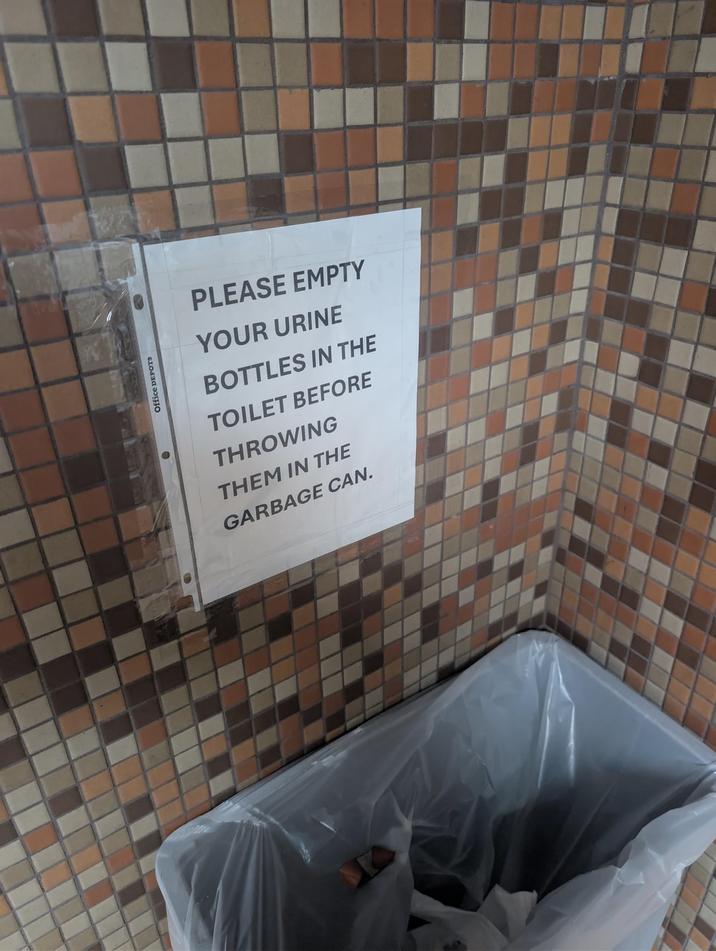 Office DEPOTS PLEASE EMPTY YOUR URINE BOTTLES IN THE TOILET BEFORE THROWING THEM IN THE GARBAGE CAN.