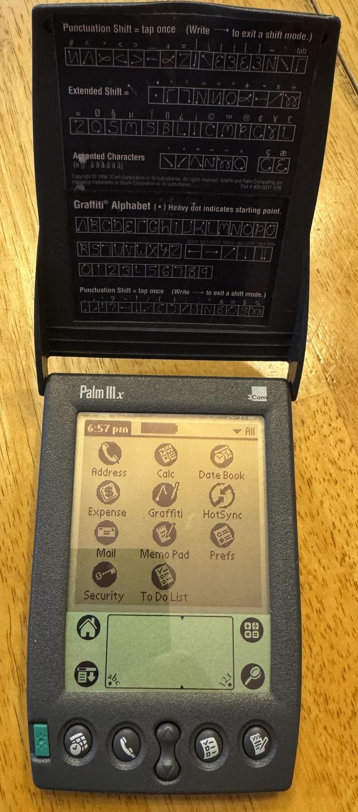 Punctuation Shift = tap once (Write to exit a shift mode.) Λ 4 > + = WA Extended Shift = § 11 2 lab E383N5 + 188 NU B¿ C TM @ ZQSMS BLICMRCYL C æ Agmented Characters NYO CE (eg á á á á á á) Copyright 1998 3Com Corporation or its subsidiaries. All rights reserved Graffil) and Palm Computing are registered trademarks of 3Com Corporation or its subsidiaries 201 Part 405-0347-01B Graffiti Alphabet (•) Heavy dot indicates starting point. ABCDEFGHIJKLMNOPO space back space return caps hiff caps lock RSTUVWXYZ- 0123 678 Punctuation Shift = tap once (Write to exit a shift mode.) ? & S % Palm III x 3Com 6:57 pm Address Calc Date Book ☑ Expense Graffiti HotSync All Mail Memo Pad Prefs 3 Security To Do List 08 08 b 123