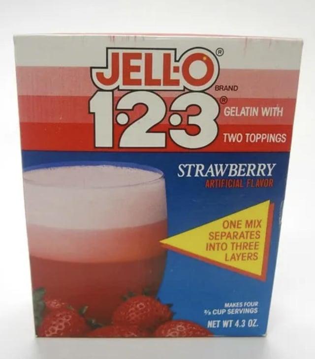 JELLO 123 BRAND GELATIN WITH TWO TOPPINGS STRAWBERRY ARTIFICIAL FLAVOR ONE MIX SEPARATES INTO THREE LAYERS MAKES FOUR % CUP SERVINGS NET WT 4.3 OZ.