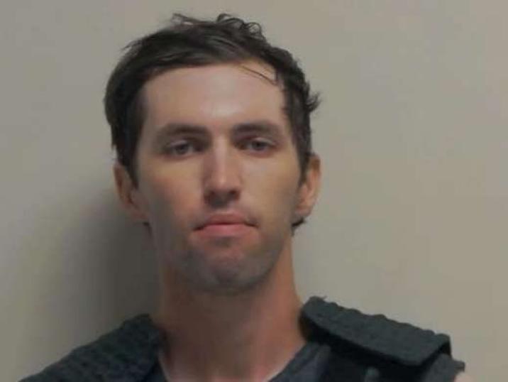 A mugshot of Tyler Robinson, the suspected shooter who "assassinated Charlie Kirk":https://knowyourmeme.com/memes/events/charlie-kirk-shooting-at-utah-valley-university at Utah Valley University in September 2025.