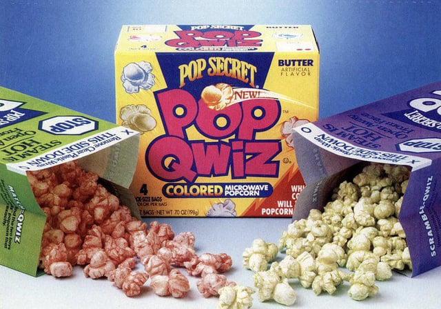 POP SECRET Lates From Fince Open Awa STEAM IS HOT POP SECRET NEW BUTTER ARTIFICIAL FLAVOR POP QWIZ OK-SIZE BAGS OLOR PER BAG MICROWAVE COLORED POPCORN 3. WILL POPCORN WH CO O + STOP HOT STEAM IS Remove Clear Plastic W THIS SIDE DOWN OP Pro Open MAT QWIZ d the two be BAGS NET WT 70 02 (198) ZIMO SCRAMBLE..