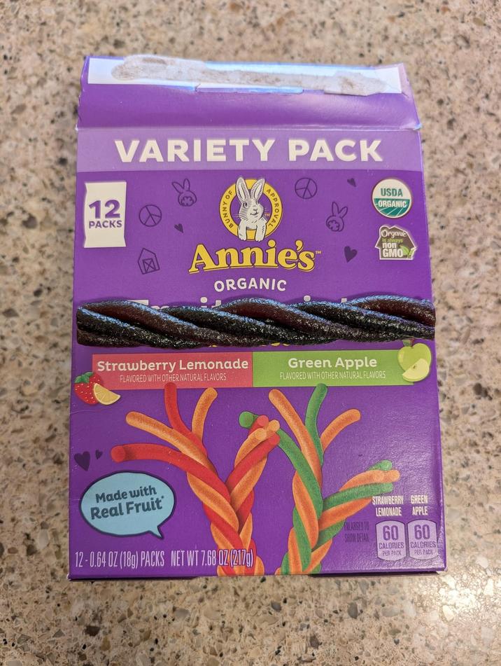 VARIETY PACK 12 PACKS USDA ORGANIC Annie's ORGANIC Strawberry Lemonade FLAVORED WITH OTHER NATURAL FLAVORS Green Apple FLAVORED WITH OTHER NATURAL FLAVORS Organic always GMO Made with Real Fruit 12-0.64 OZ (18g) PACKS NET WT 7.68 02 (217) STRAWBERRY GREEN LEMONADE APPLE ENLARGED TO SHOW DETAIL 60 60 CALORIES PER PACK CALORIES PER PACK