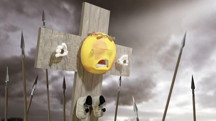 A 3D render of Joe, the "emoji":https://knowyourmeme.com/memes/emoji guy, being crucified like "Jesus Christ":https://knowyourmeme.com/memes/people/jesus.