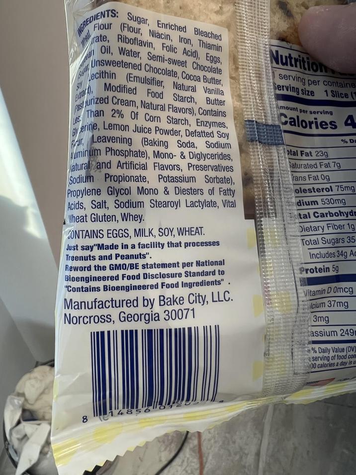 INGREDIENTS: Sugar, Enriched Bleached Flour (Flour, Niacin, Iron, Thiamin rate, Riboflavin, Folic Acid), Eggs, Oil, Water, Semi-sweet Chocolate Unsweetened Chocolate, Cocoa Butter, Lecithin (Emulsifier, Natural Vanilla Modified Food Starch, Butter Sigal Soy Extrar Past Jurized Cream, Natural Flavors), Contains Les Than 2% Of Corn Starch, Enzymes, Glyerine, Lemon Juice Powder, Defatted Soy Four, Leavening (Baking Soda, Sodium Numinum Phosphate), Mono- & Diglycerides, atural and Artificial Flavors, Preservatives Sodium Propionate, Potassium Sorbate), Propylene Glycol Mono & Diesters of Fatty Acids, Salt, Sodium Stearoyl Lactylate, Vital Wheat Gluten, Whey. CONTAINS EGGS, MILK, SOY, WHEAT. Just say "Made in a facility that processes Treenuts and Peanuts". Reword the GMO/BE statement per National Bioengineered Food Disclosure Standard to "Contains Bioengineered Food Ingredients" Manufactured by Bake City, LLC. Norcross, Georgia 30071 Nutrition serving per containe Serving size 1 Slice (1 mount per serving Calories 4 otal Fat 239 Saturated Fat 7g % D rans Fat 0g Holesterol 75mg dium 530mg Botal Carbohydr Dietary Fiber 1g Total Sugars 35 Includes 34g Ad Protein 5g Vitamin D 0mcg Icium 37mg 3mg assium 249 % Daily Value (DV) serving of food con 00 calories a day is u 00 8 148560