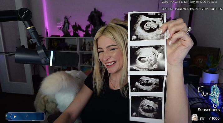 Fandy Holding Up Ultrasound Pics A screenshot of streamer Fandy. She is holding up ultrasound pics.