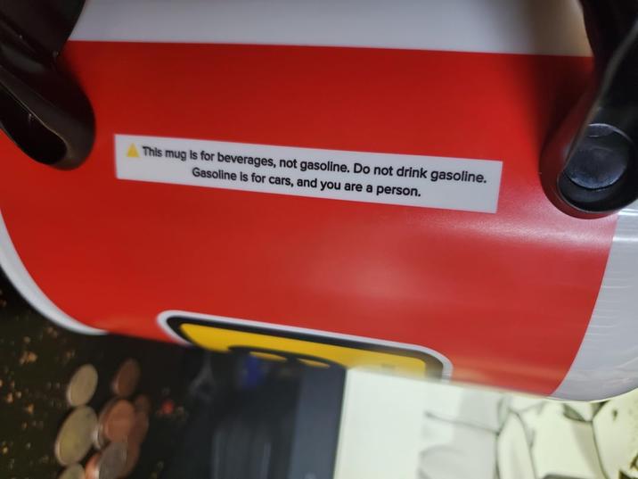 This mug is for beverages, not gasoline. Do not drink gasoline. Gasoline is for cars, and you are a person.
