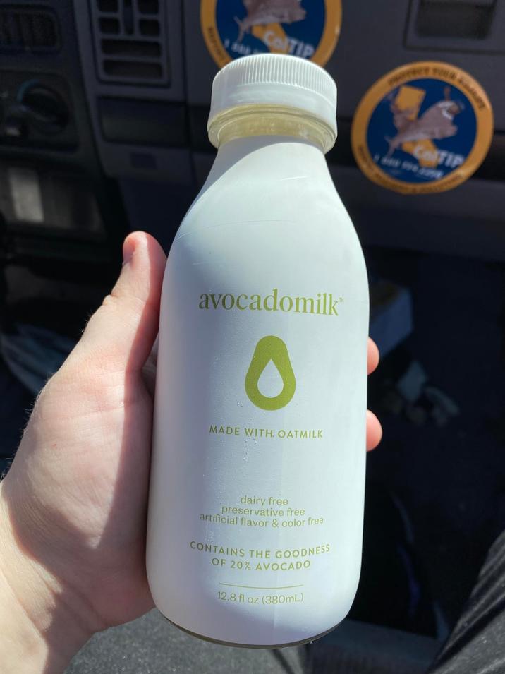 ILD H ColTIP YOUR avocadomilk 0 MADE WITH. OATMILK dairy free preservative free artificial flavor & color free CONTAINS THE GOODNESS OF 20% AVOCADO 12.8 fl oz (380mL) COTIP
