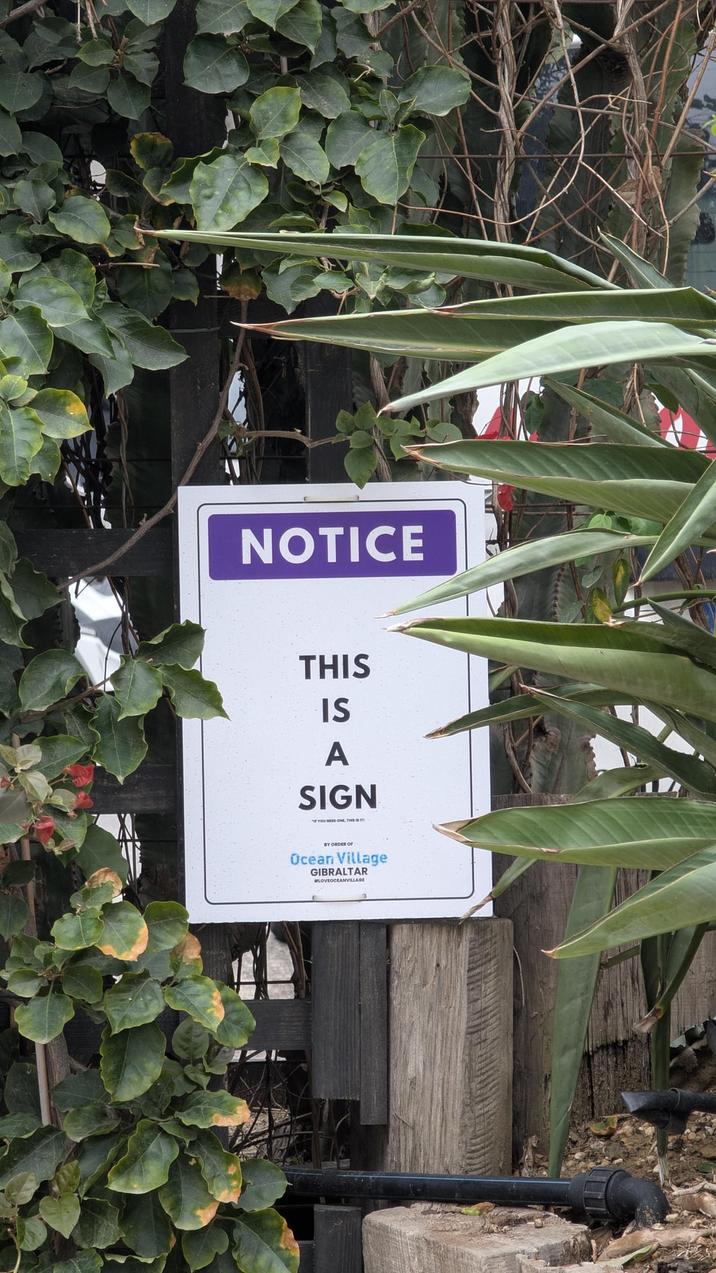 NOTICE THIS IS A SIGN *YOU NEED ON TH BY ORDER OF Ocean Village GIBRALTAR #LOVEOCEANVILLAGE