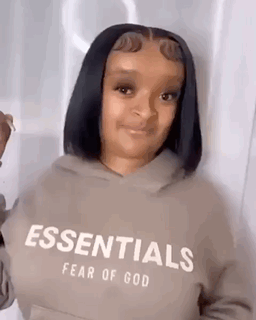 One of the earliest known GIF reposts of a Black woman named Navaeh laughing while showing off her silky bob hair cut.