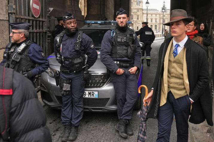  Photographer Thibault Camus' photo, "Police officers block an access to the Louvre museum after a robbery Sunday, Oct. 19, 2025, in Paris." 