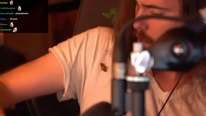 A roach jumps on Asmongold's shoulder. 