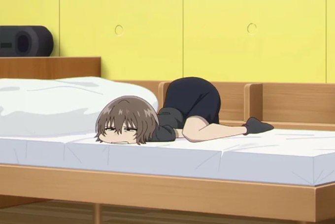 An image from season 2 episode 12 of Yofukashi no Uta. The image shows Anko lying in bed with her posterior in the air.