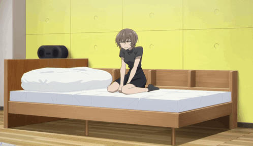 A GIF of Anko from Call of the Night lying in bed hungover. The scene is from season 2 episode 12.