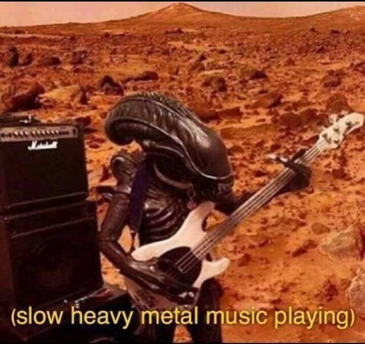 (slow heavy metal music playing)