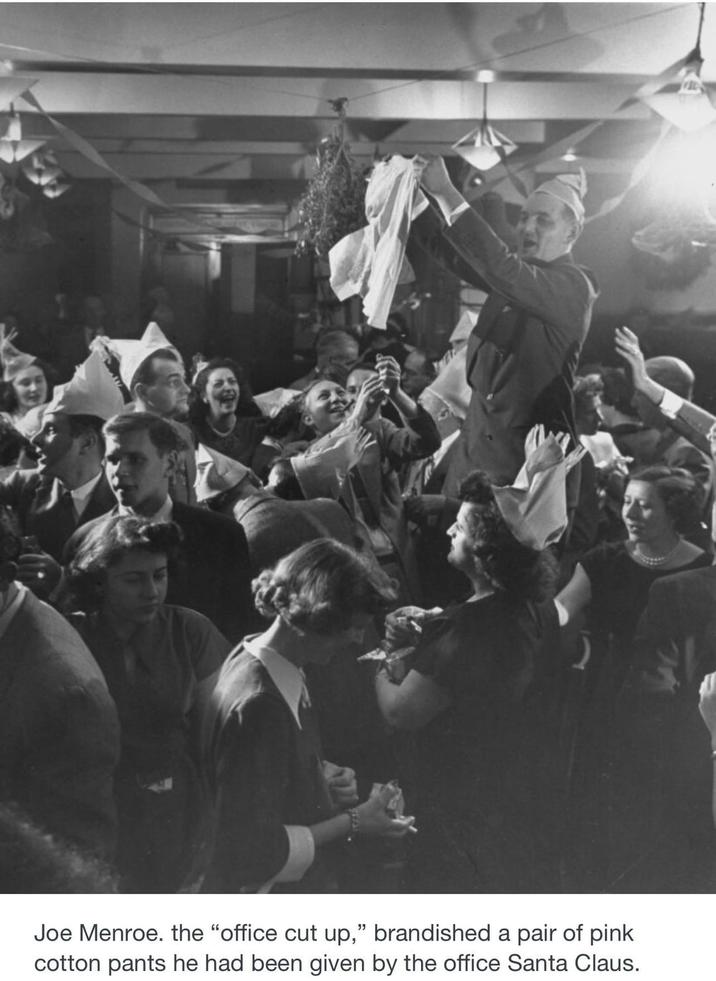 Joe Menroe. the "office cut up," brandished pair of pink cotton pants he had been given by the office Santa Claus.