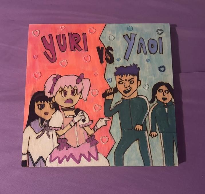 A piece of art by Custom Wood Burning. The art is titled "Yuri vs. Yaoi" and features characters from Squid Game and Madoka Magica.
